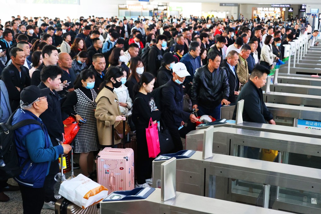 Passengers pass through ticket barriers at a railway station prior in Lianyungang, Jiangsu province. Photo: VCG via Getty Images