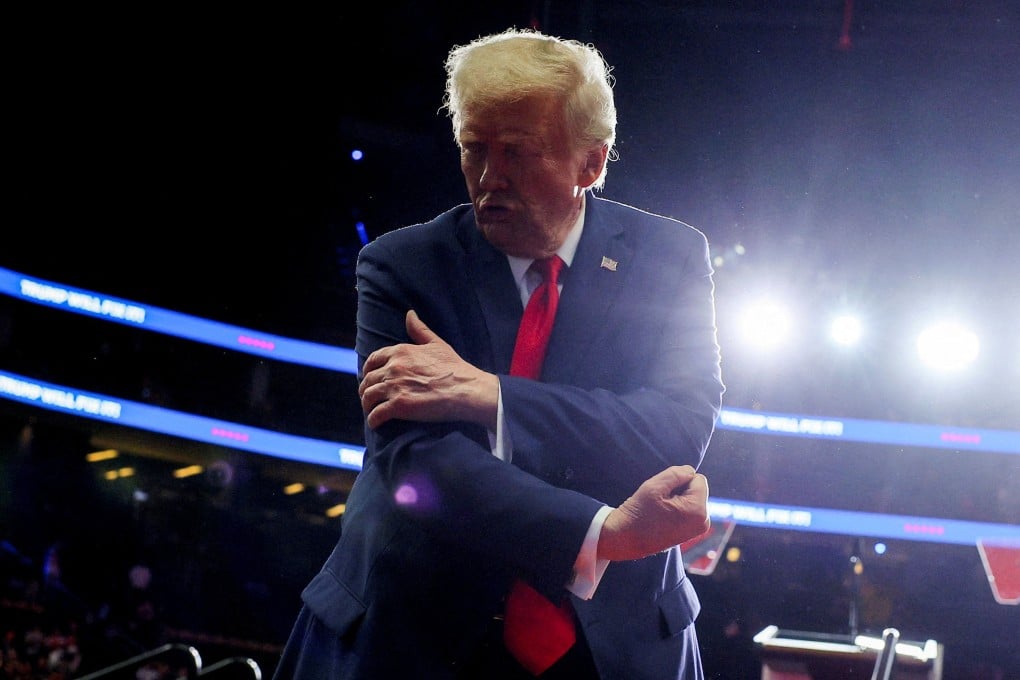Donald Trump flexes his muscles during a campaign rally in Pittsburgh, Pennsylvania, on Monday. Photo: Reuters