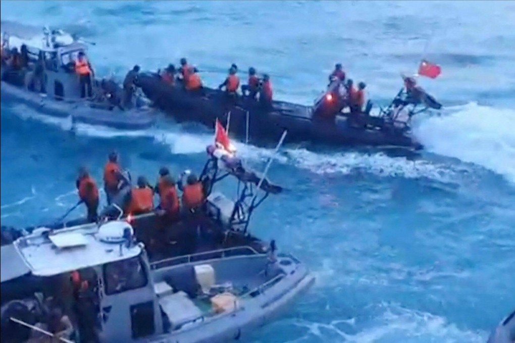 Chinese coastguard personnel during a confrontation with the Philippine navy in the disputed South China Sea in June. Photo: AFP