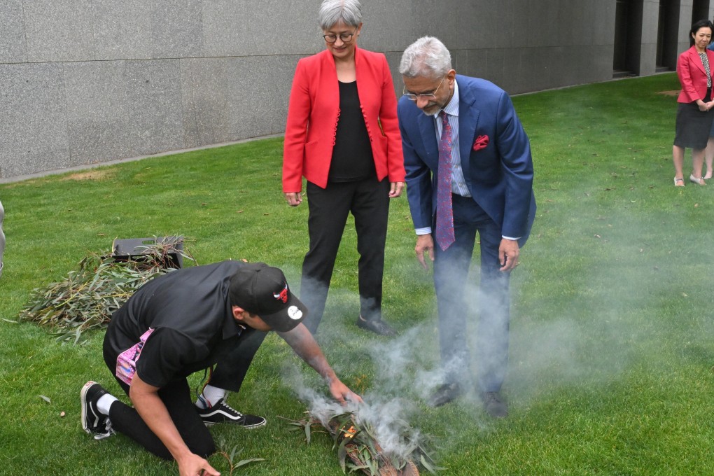 India’s External Affairs Minister S. Jaishankar attends a smoking ceremony at Parliament House in Canberra on Tuesday with Australia’s Foreign Affairs Minister Penny Wong. Photo: EPA-EFE