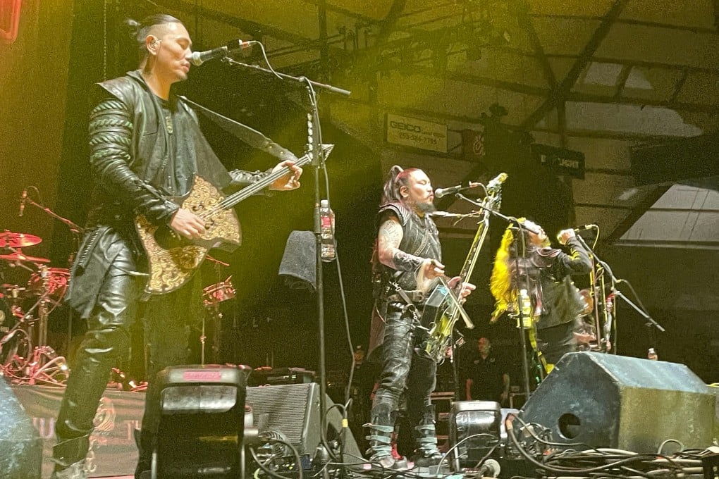 (From left) Temuulen “Temka” Naranbaatar, Galbadrakh “Gala” Tsendbaatar and Nyamjantsan “Jaya” Galsanjamts of The Hu perform with the rest of the Mongolian heavy metal band at the Tacoma Dome in the US state of Washington on October 16, 2024. Photo: AP