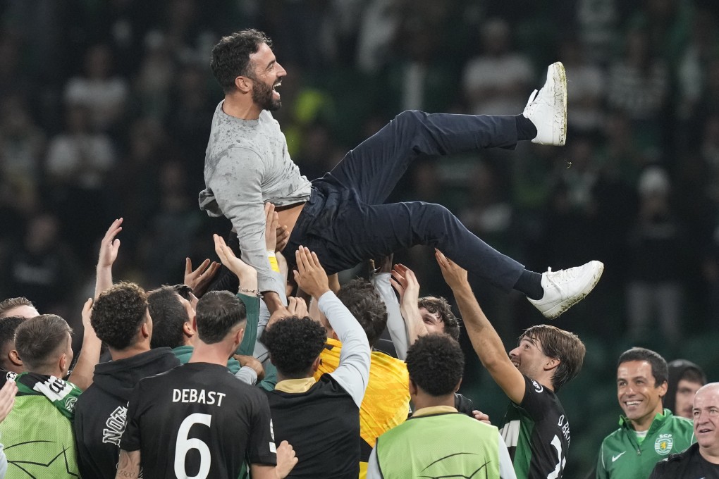 Sporting players toss coach Ruben Amorim in the air to celebrate their historic 4-1 victory over Manchester City in his final home match in charge. Photo: AP
