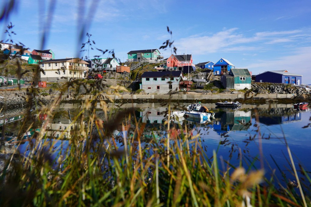 The Old Colonial Harbour in Nuuk, Greenland’s capital. A new runway at Nuuk airport that can accommodate international flights is expected to lift the tourism sector, at the risk of inundating the infrastructure and fragile ecosystem of the Arctic island. Photo: AFP
