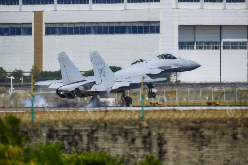 A PLA Navy J-15T fighter lands at Zhuhai on Wednesday. Photo: PLA