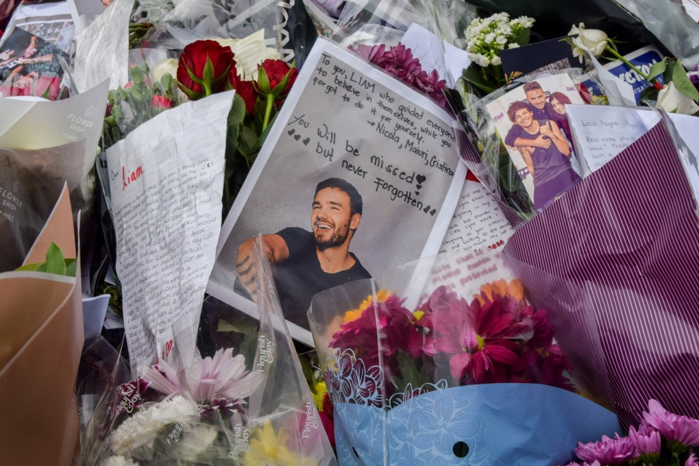 Fans leave tributes at a memorial for Liam Payne in London after he died in Buenos Aires. Despite success with One Direction, Payne struggled with addiction and the pressures of his post-band fame. Photo: Getty Images