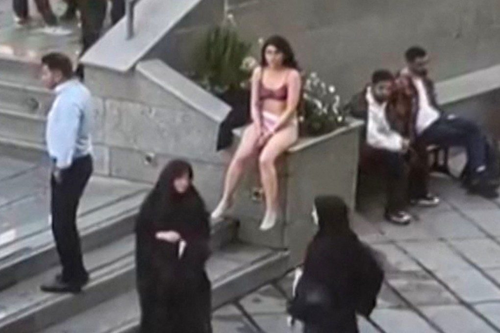 Footage widely shared on social media shows a female student in her underwear outside Tehran’s Islamic Azad University. Photo: UGC via AFP