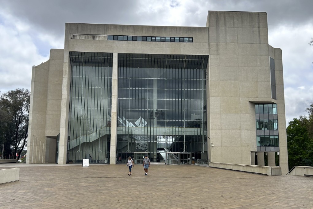 People walk outside the High Court building in Canberra, Australia. Photo: AP