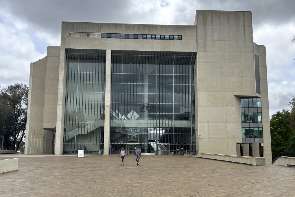 People walk outside the High Court building in Canberra, Australia. Photo: AP