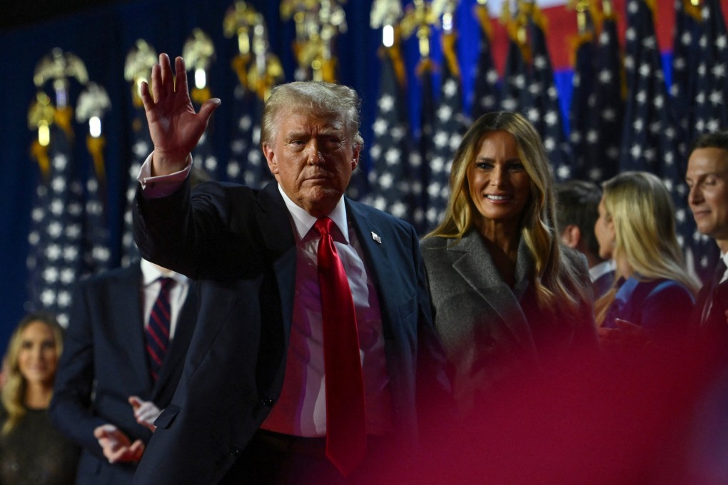 Donald Trump waves while walking off stage following early results from the 2024 US presidential election in Palm Beach County Convention Center, in West Palm Beach, Florida. Photo: Reuters