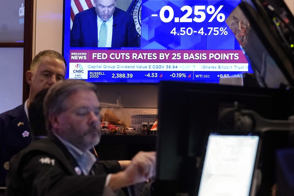 A screen on the floor of the New York Stock Exchange shows the Federal Reserve rate decision on Thursday. Photo: AP