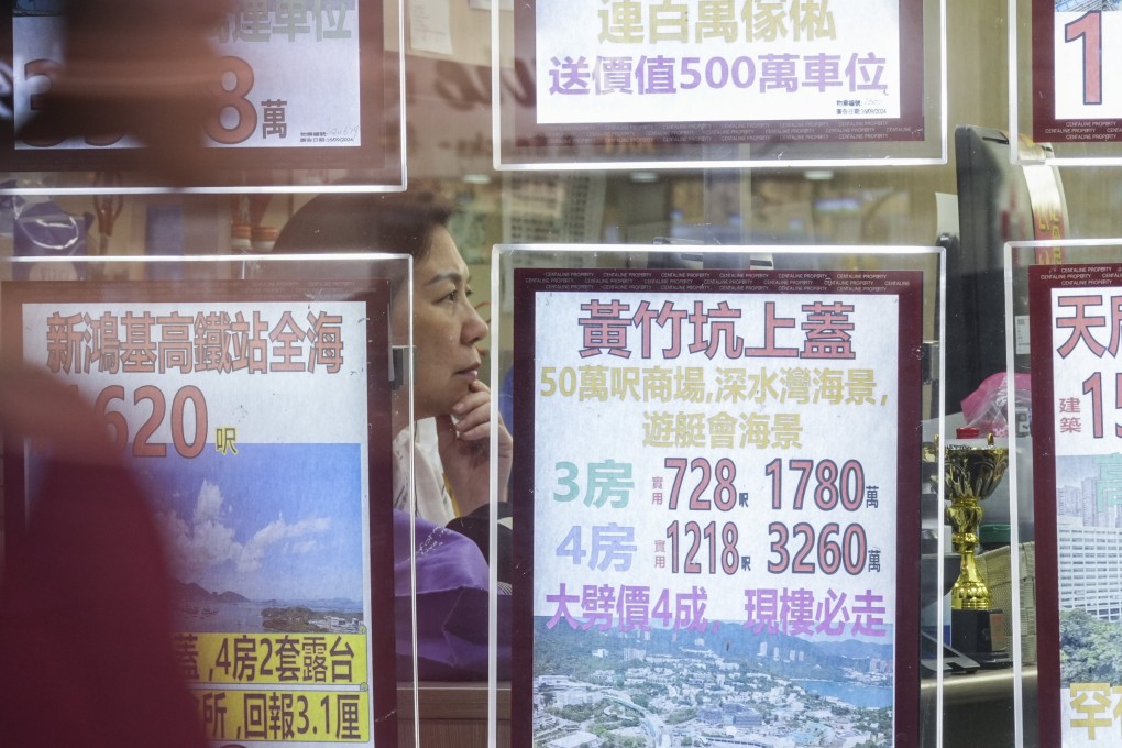 Staff work at a real estate agency in North Point on October 29, 2024. Photo: Eugene Lee