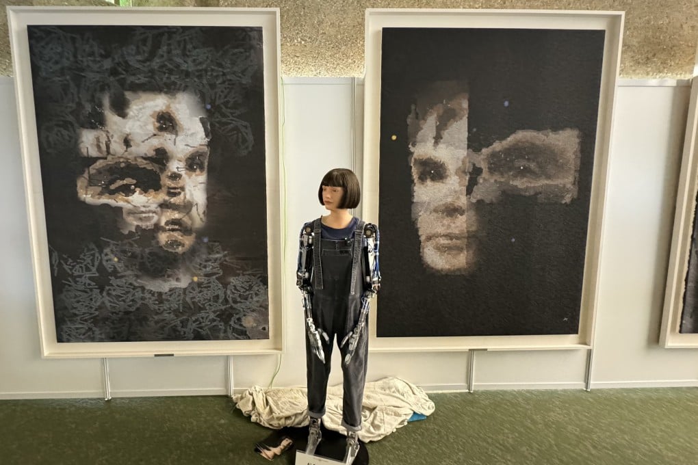 Ai-Da in front of the portrait of Alan Turing. Photo: Sotheby’s via EPA-EFE