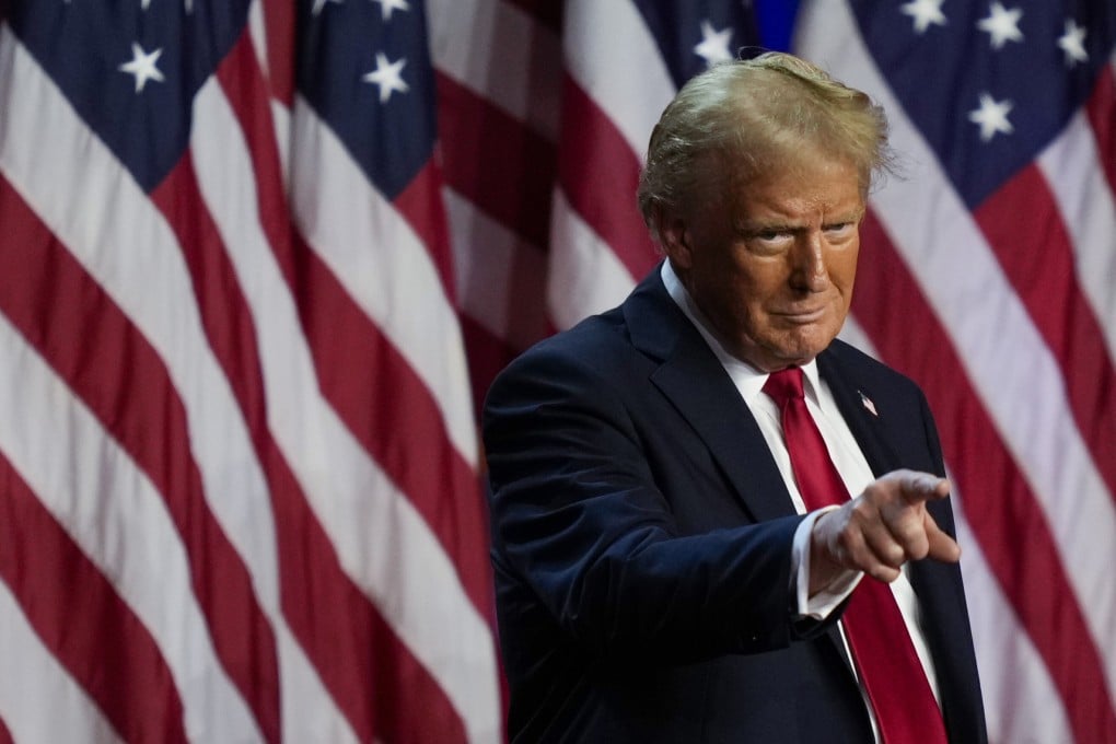 Donald Trump points to the crowd at an election night watch party in West Palm Beach, Florida, on Wednesday. Photo: AP