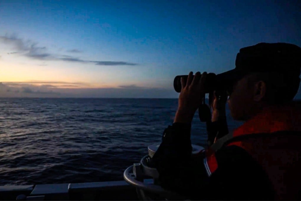 A member of the crew on a mainland Chinese vessel keeps watch as the PLA carries out drills around Taiwan, a point of contention with Washington. Photo: Handout