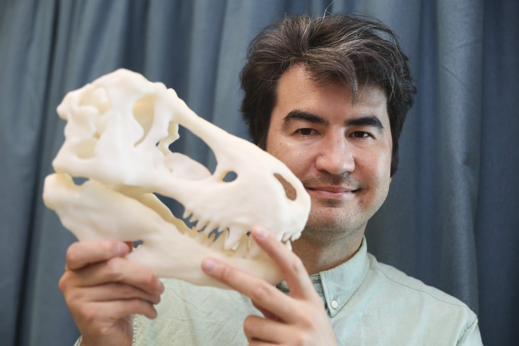Michael Pittman, life science assistant professor at the Chinese University of Hong Kong, shows a 3D-printed dinosaur bone model. Photo: Edmond So