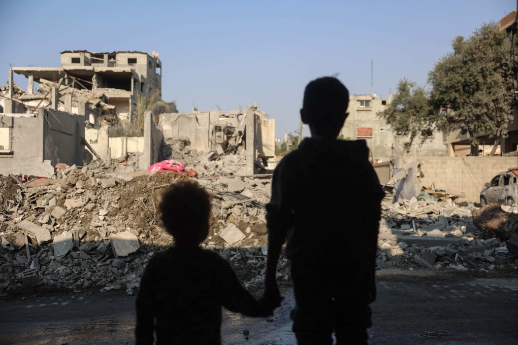 Children stare at the destruction after an Israeli strike in the Nuseirat refugee camp in the central Gaza Strip on Thursday. Photo: AFP