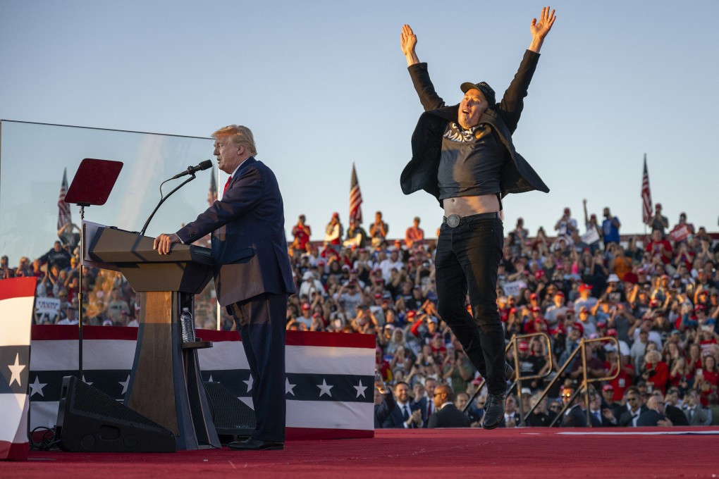 Tesla CEO Elon Musk, right, jumps on stage as he joins President-elect Donald Trump during a campaign rally  in Butler, Pennsylvania, on Oct. 5, 2024. Photo: AFP/Getty Images/TNS