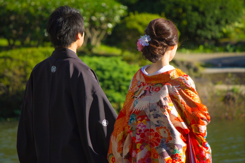 A young Japanese couple at a garden in Tokyo. Photo: Shutterstock