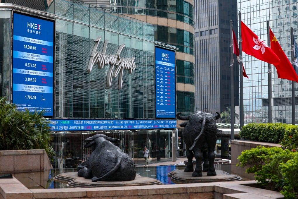 Screens show stock information outside Exchange Square in Central, Hong Kong, on February 15, 2024. Photo: Sun Yeung