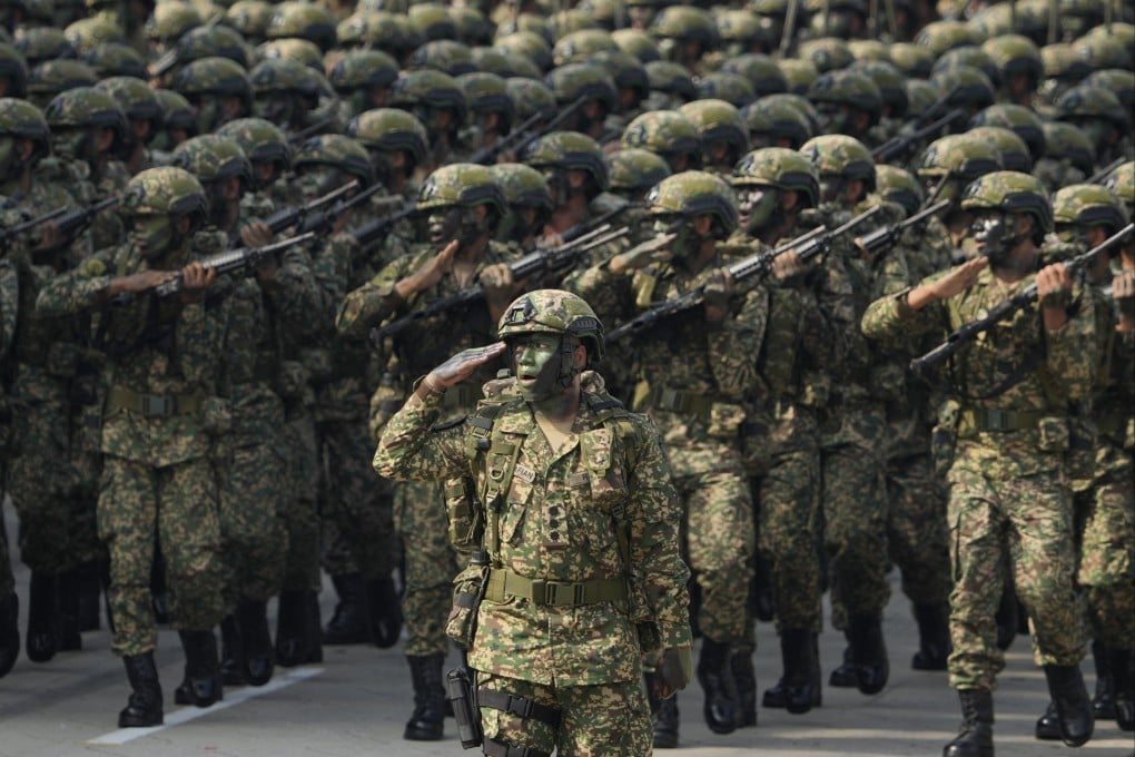 Royal Malaysia Army troops march during the National Day celebrations in Kuala Lumpur in 2022. Photo: AP