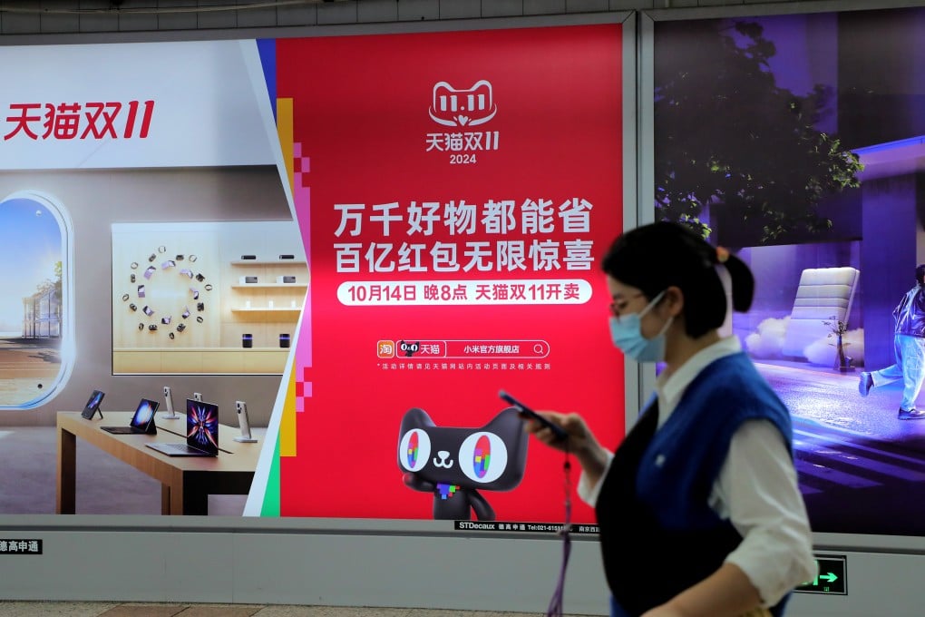 A pedestrian walks by an advertisement promoting Tmall’s Double 11 shopping promotion in Shanghai. Photo: VCG via Getty Images