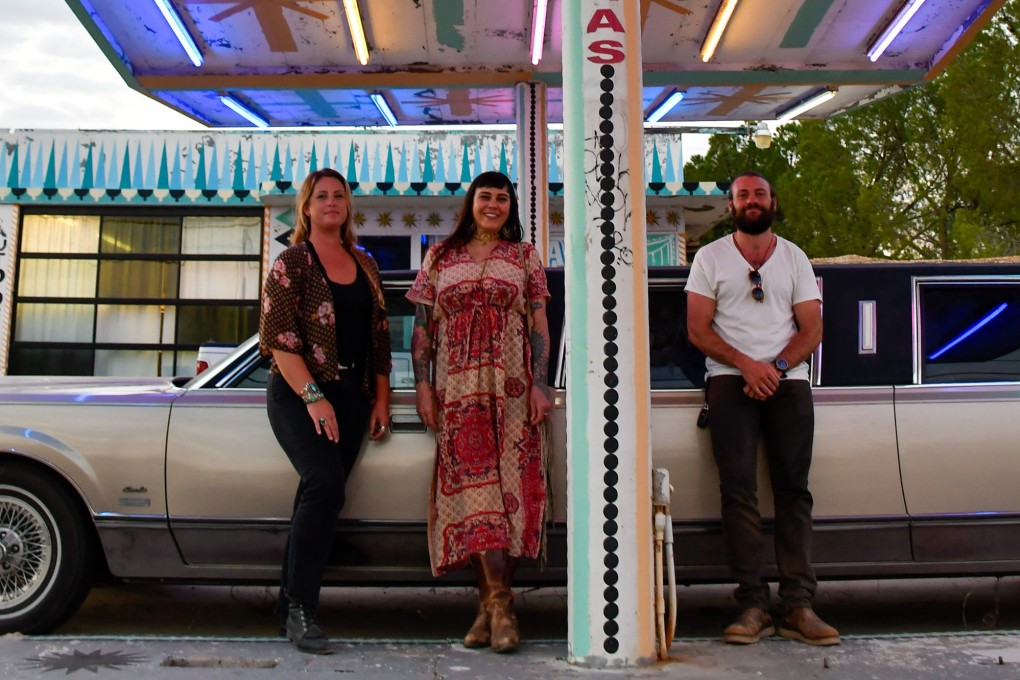 (From left) Jacumba Hot Springs Hotel co-owners Corbin Winters, Melissa Strukel and Jeff Osborne outside the old service station that serves as their office, in Jacumba Hot Springs in San Diego county, in the US state of California. Photo: TNS