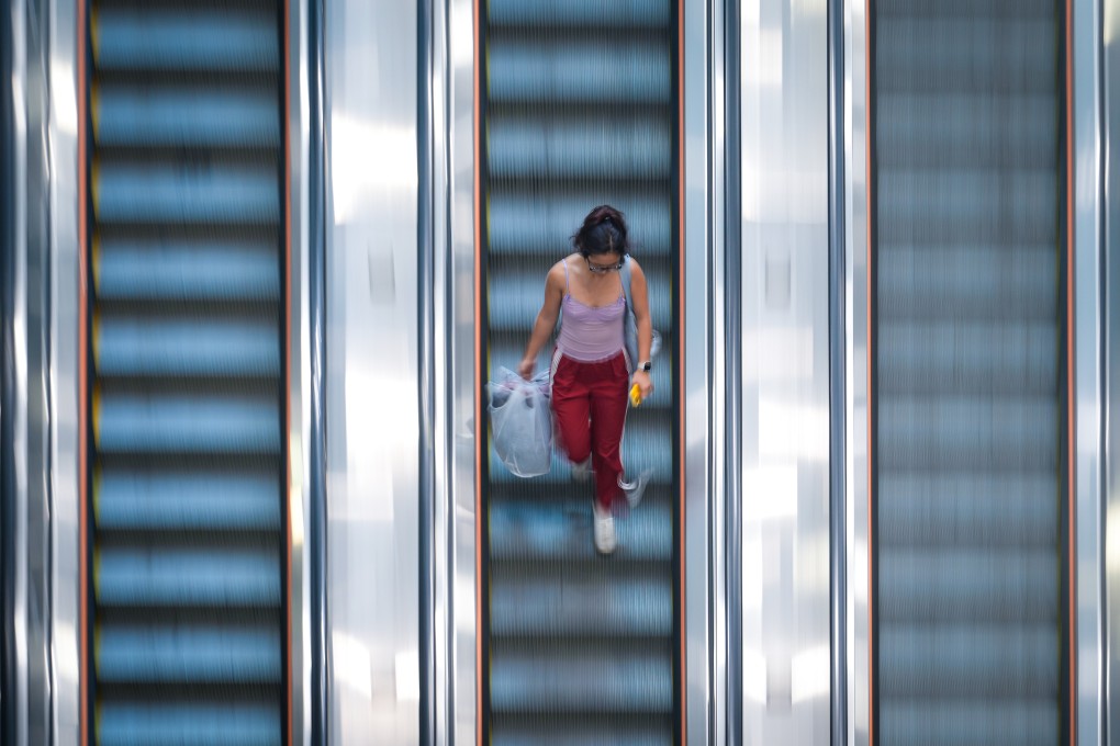 A passenger walks down an escalator in Admiralty MTR Station on November 11. Photo: Sam Tsang