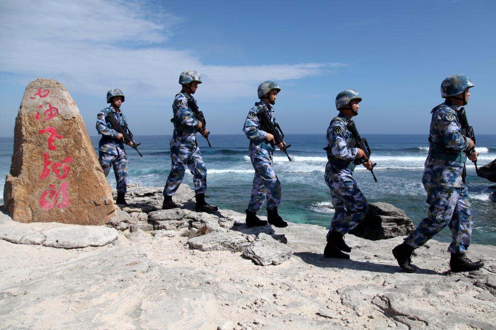 Chinese marines on patrol on Woody Island in the Paracels, which falls under the jurisdiction of the city of Sansha. Photo: Reuters
