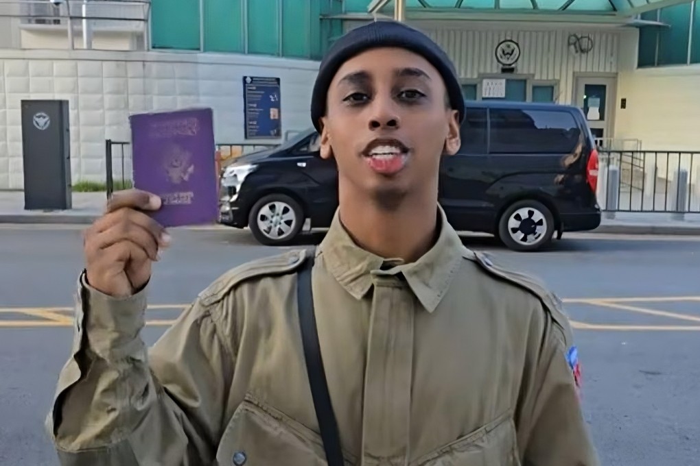 US live-streamer Johnny Somali, real name Ramsey Khalid Ismael, waves around his US passport in a video he posted to TikTok on Tuesday. Photo: TikTok/JohnnySomali