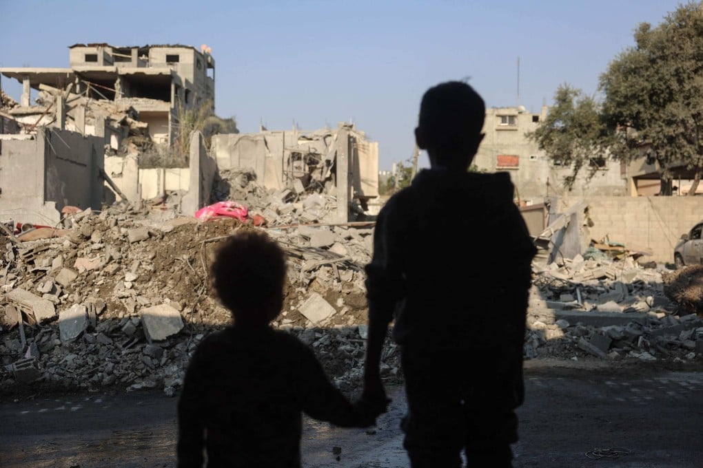 Children stare at the destruction following an Israeli strike in the Nuseirat refugee camp in the central Gaza Strip on November 7, 2024. Photo: AFP