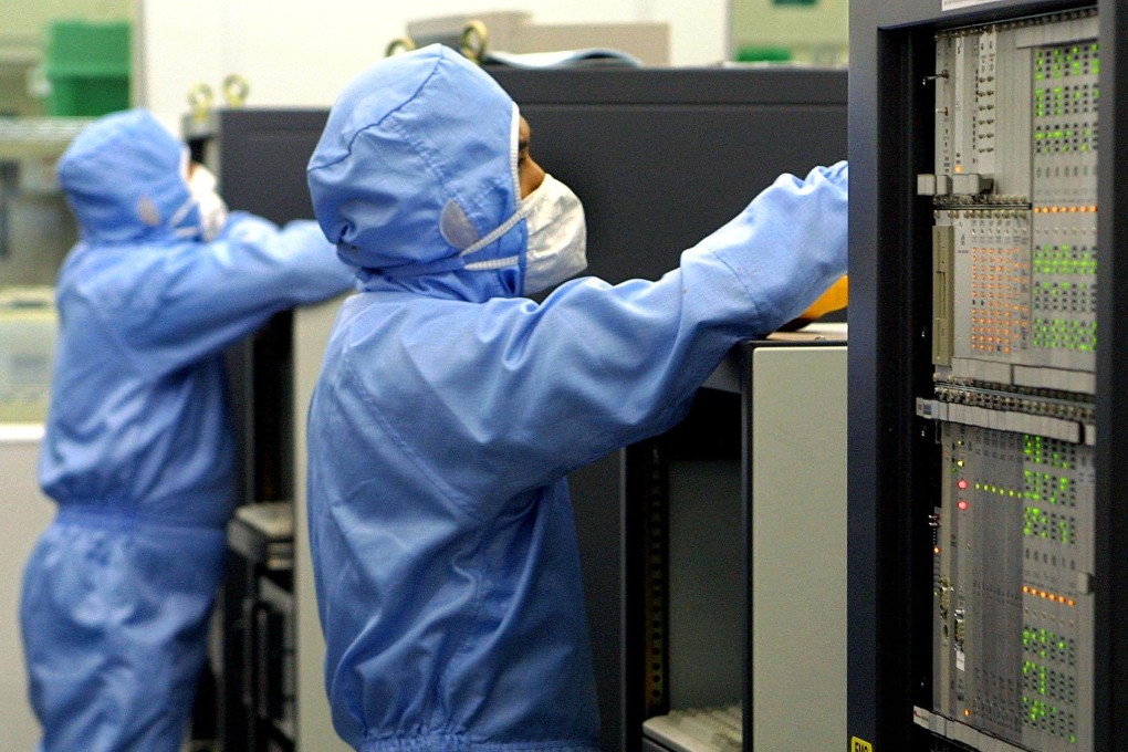 Technicians work at a semiconductor plant in Kuala Lumpur. Photo: AFP