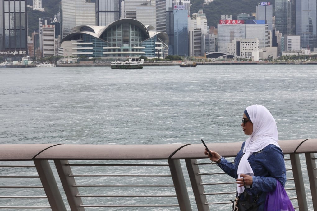 A Muslim tourist at the Tsim Sha Tsui waterfront – Hong Kong wants to encourage more Muslim visitors to come to the city. Photo: Jelly Tse