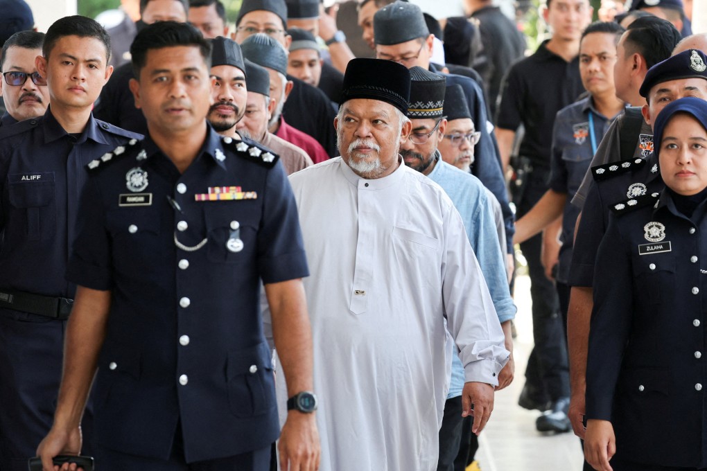 GISB CEO Nasiruddin Mohd Ali arrives at Selayang court to face charges. GISB has long been controversial for its ties to the Al-Arqam sect, which has been banned in Malaysia since 1994 for its deviant teachings and cultlike activities. Photo: Reuters