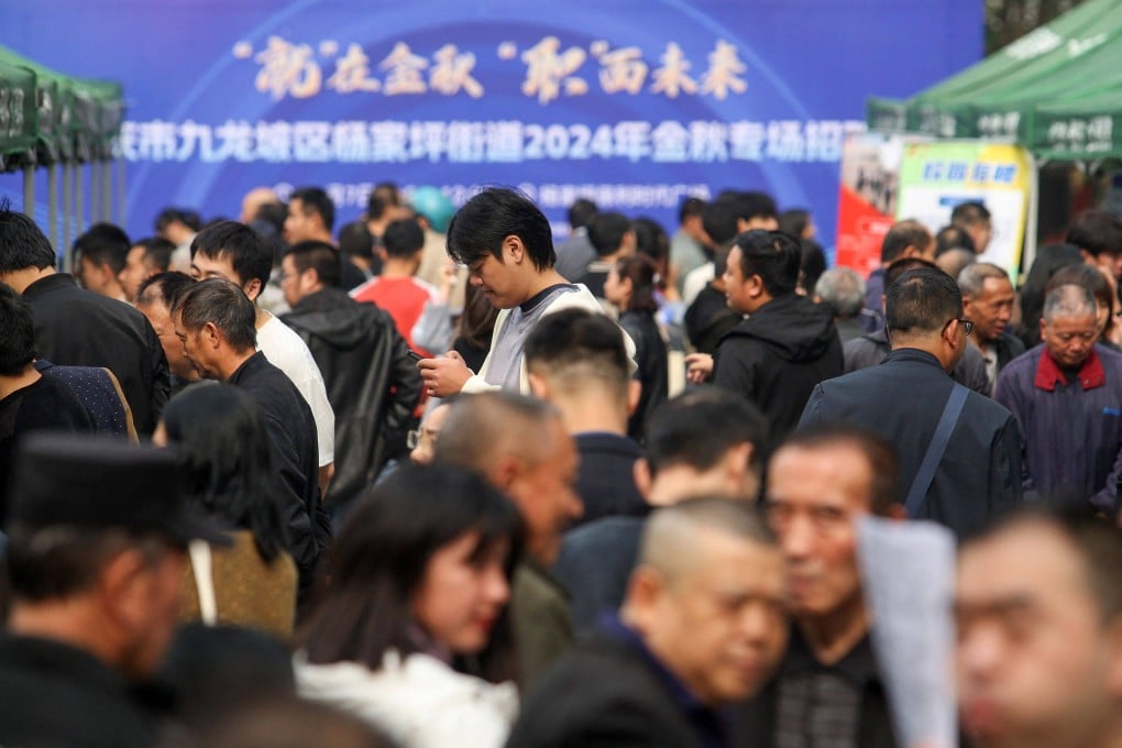 People look for work at a job fair in Chongqing, southwest China, on November 7. Photo: AFP
