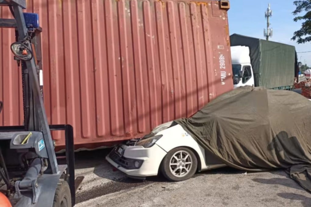 21-year-old Lee Zi Rou was killed when a container rolled off a semi-truck and fell onto her car. Photo: Penang State Fire and Rescue Department