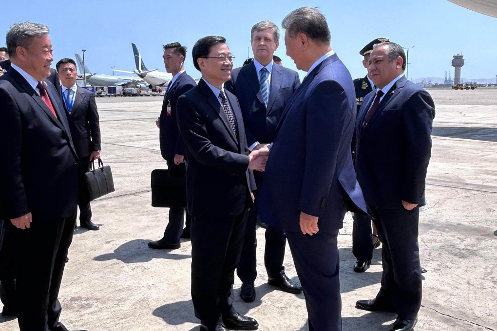 Hong Kong leader John Lee (second left) greets Chinese President Xi Jinping (second right) in Lima, Peru, on Thursday. Photo: ISD