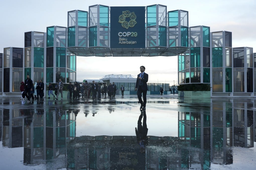 Attendees arrive for the Cop29 UN climate summit in Baku, Azerbaijan, on Thursday. Photo: AP