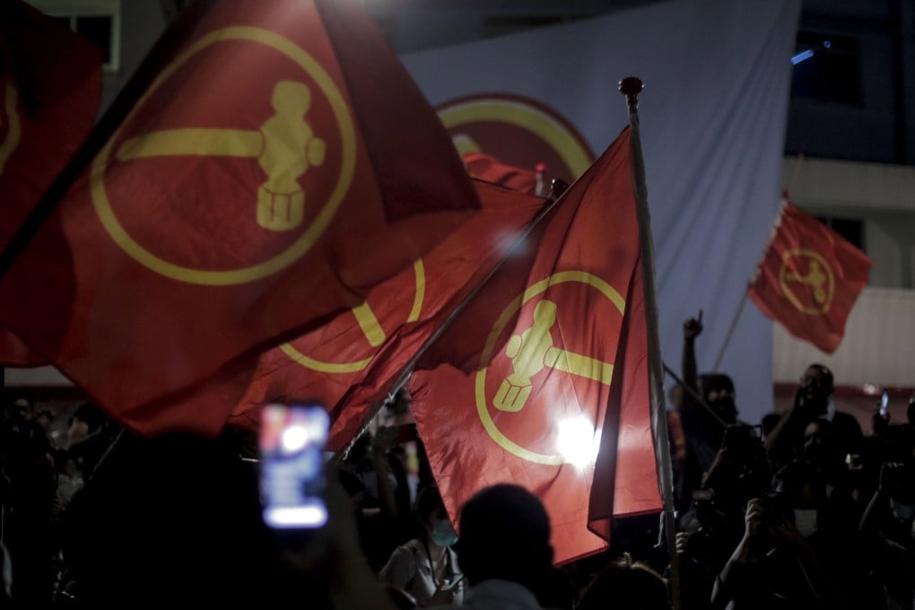 Supporters of the opposition Workers’ Party wave party flags in Singapore in 2020. Photo: EPA-EFE