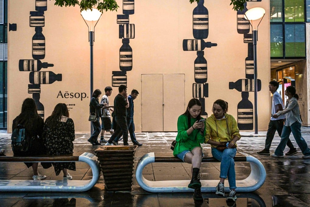 People visit a shopping centre complex in Beijing. China’s retail sales posted strong growth in October on the back of stimulus measures. Photo: AFP