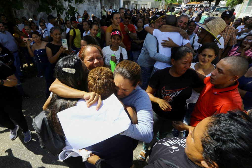 People receive their loved ones following their release after being arrested during protests over the disputed Venezuelan elections. Photo: Reuters