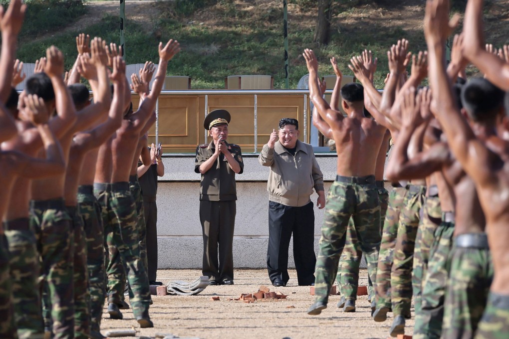 North Korean leader Kim Jong-un gives troops a thumbs-up during a visit to a special forces training base in September. Photo: Korean Central News Agency via KNS/dpa