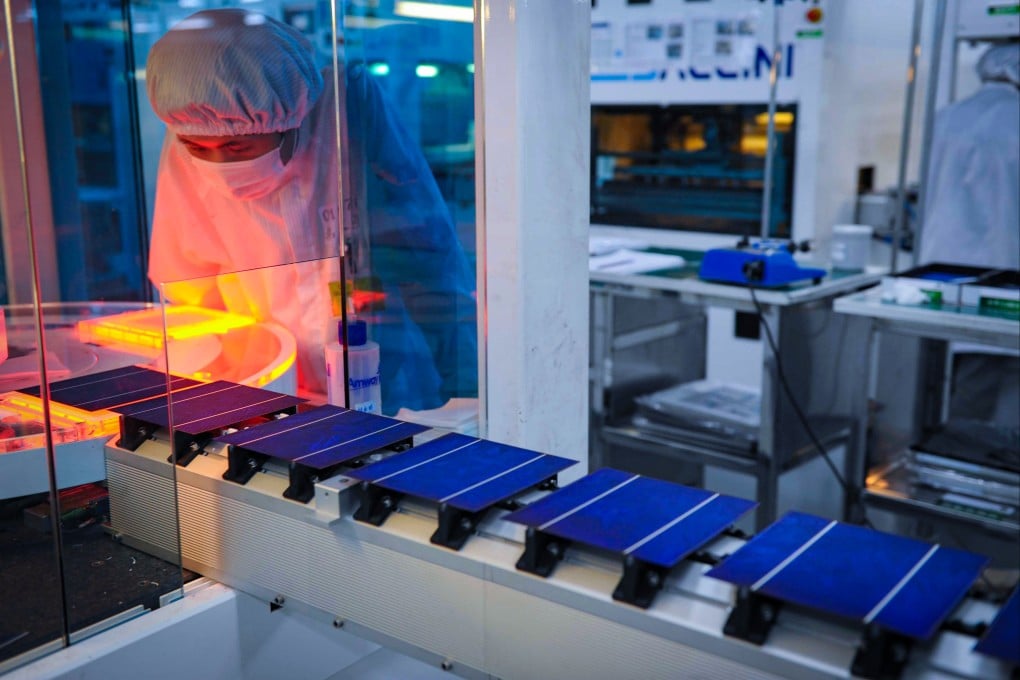 A worker monitors a solar-panel production line in China’s Zhejiang province. Photo: AP