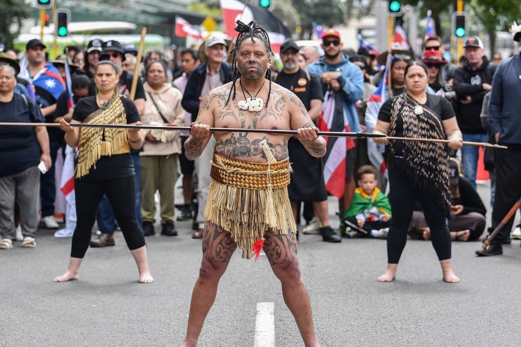Members of the Maori community and their supporters take part in a protest march in Wellington on Tuesday. More than 35,000 demonstrators poured into the harbourside, police said. Photo: AFP