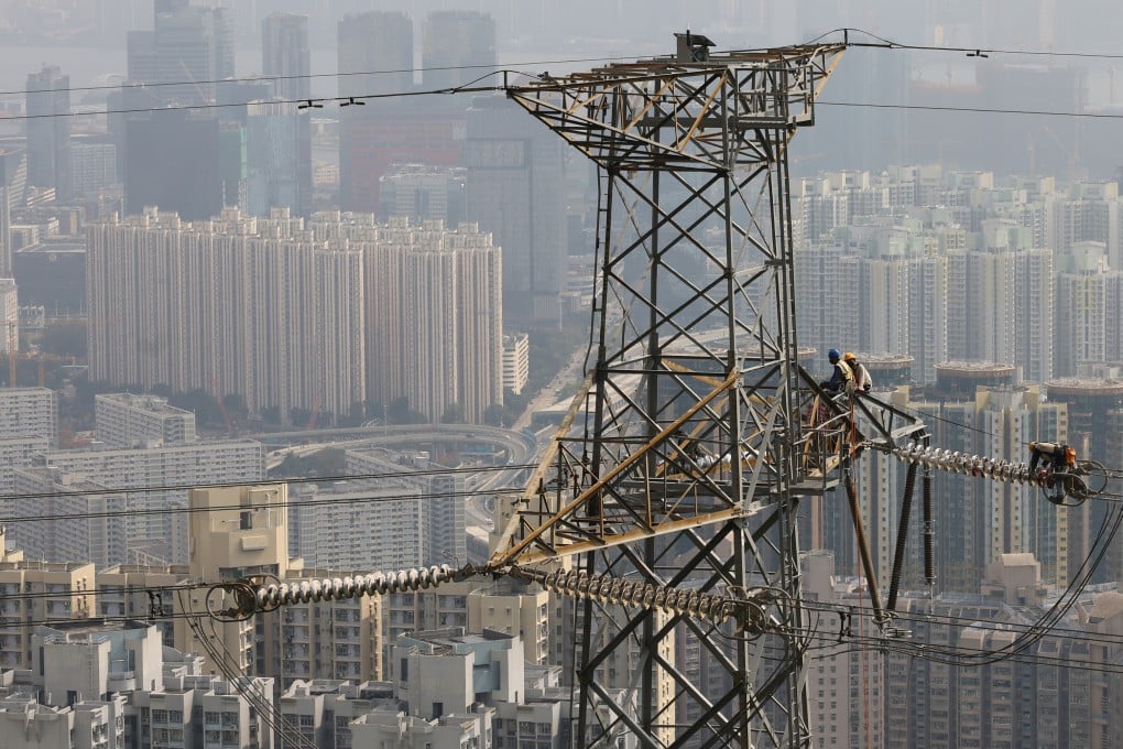 Workers on an electricity tower near Shatin Pass Road. Hong Kong’s two electricity companies have announced increases in rates, beginning in January 2025. Photo: Dickson Lee