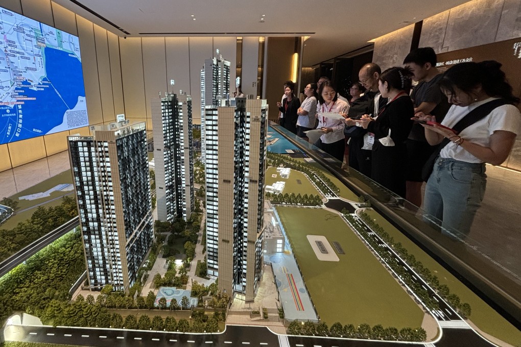 Chinese homebuyers gathered at a property showroom in Shenzhen. New home prices in China fell for the 17th month in October, but at a slower pace. Photo: Yulu Ao