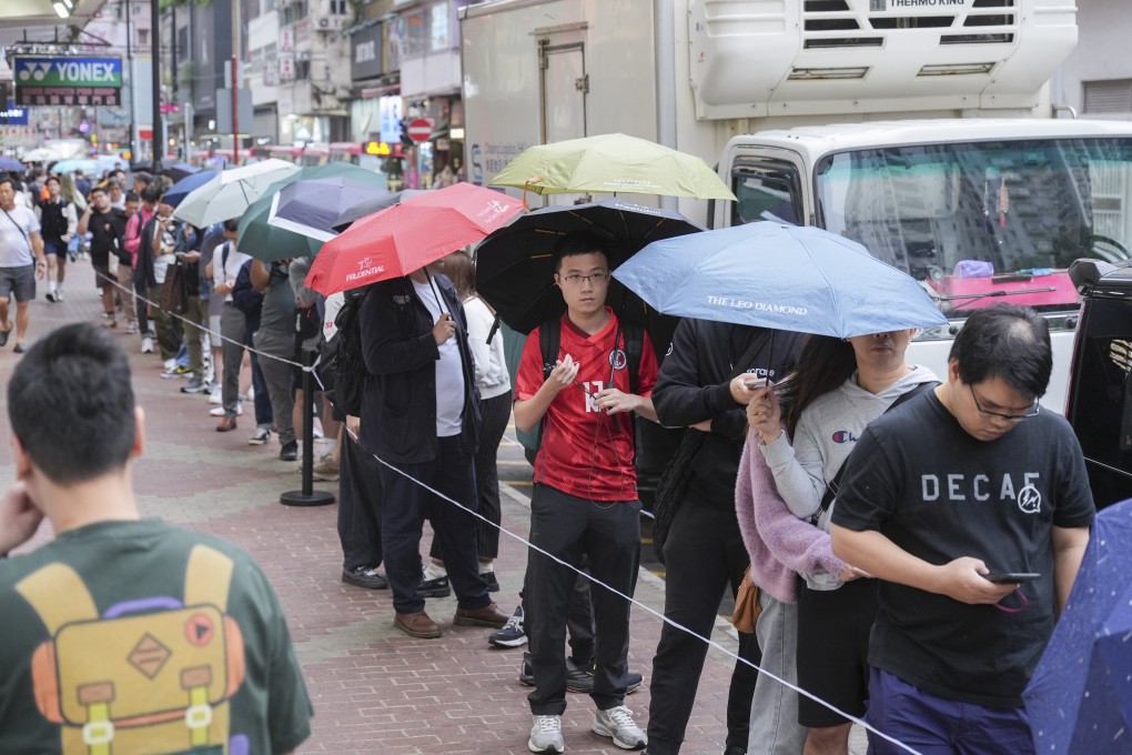 Football fans queued for up to an hour outside a Nike store in Mong Kok, where 1,000 shirts were expected to be sold. Photo: Eugene Lee