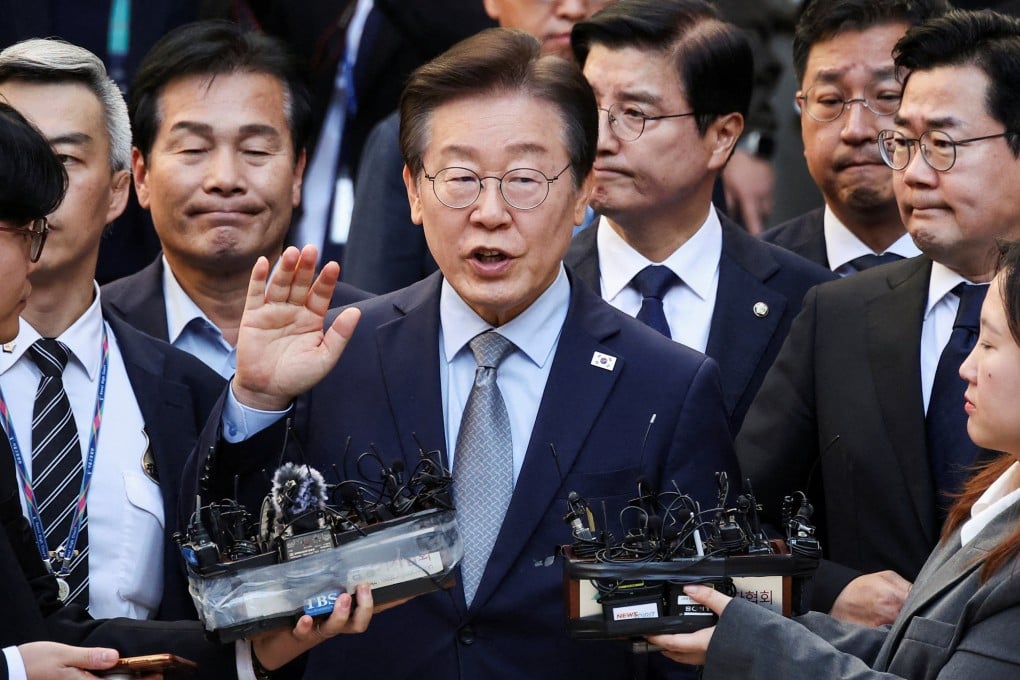 South Korea’s main opposition Democratic Party Leader Lee Jae-myung speaks as he leaves court on Friday after being convicted on charges of violating election law. Photo: Reuters