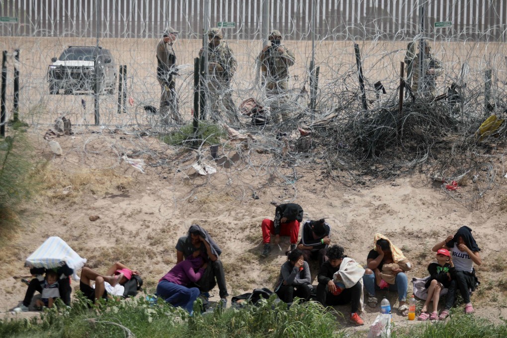 Migrants seeking asylum in the United States being watched by the Texas National Guard. File photo: AFP