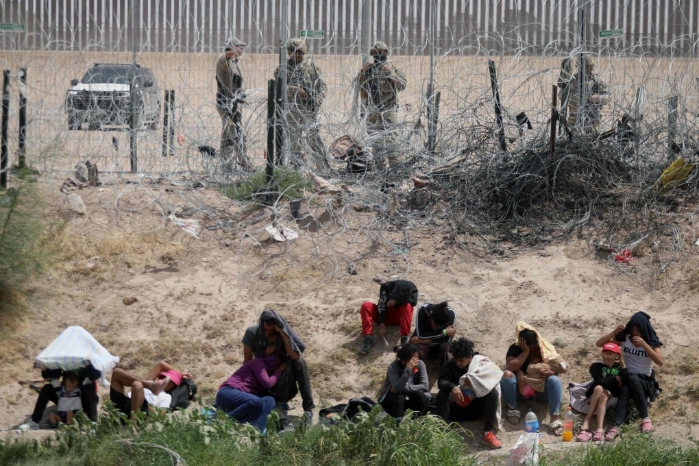 Migrants seeking asylum in the United States being watched by the Texas National Guard. File photo: AFP