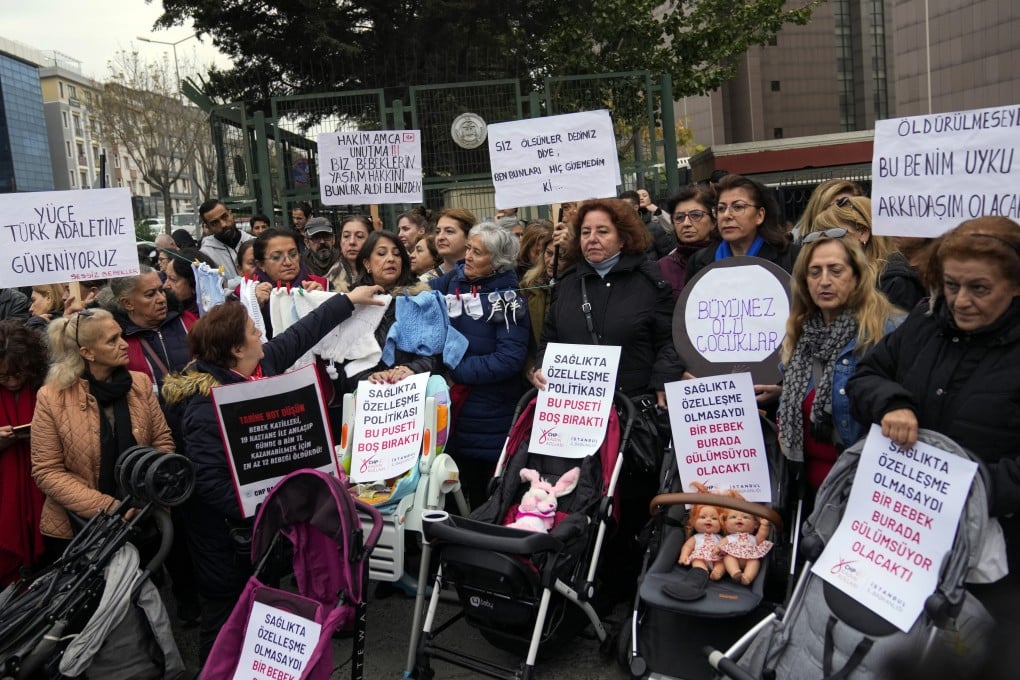 Activists protest outside the courthouse where dozens of Turkish health care workers are on trial. Photo: AP